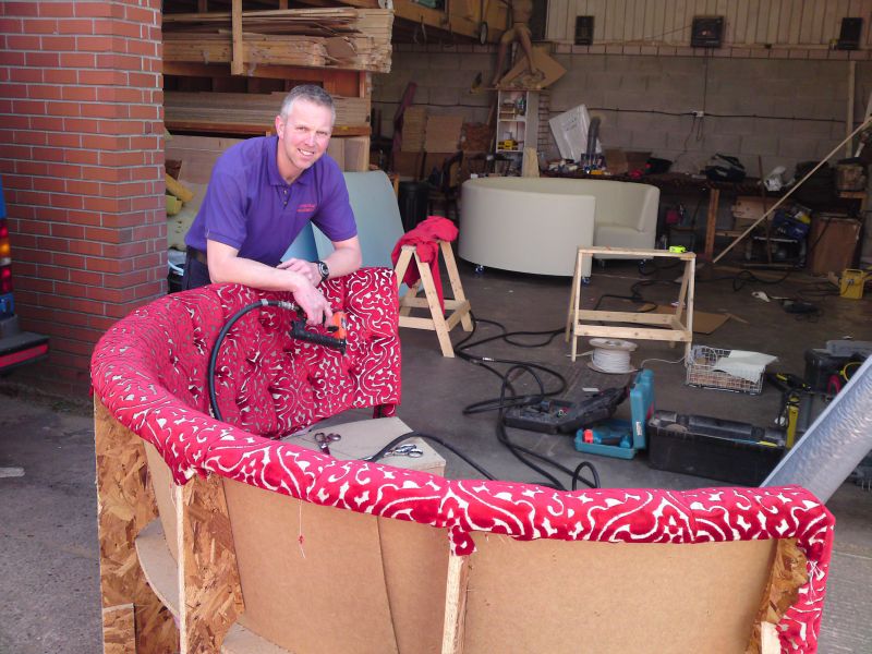 An image of Ian working on some seating.