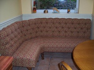 An image of blue deep buttoned seating.