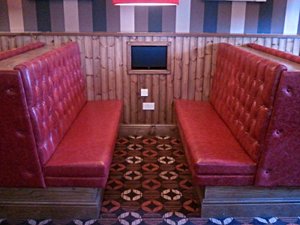 An image of blue deep buttoned seating.