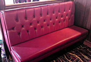 An image of blue deep buttoned seating.